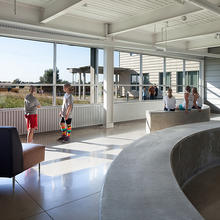 This photo shows the school lobby, another daylight-flooded gathering space. - Photo Credit: Credit: (c) Farshid Assassi