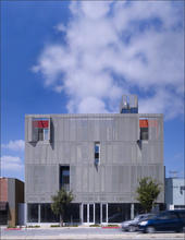 The main entrance, including retail frontage on the first floor, can be seen in this photo. - Photo Credit: John Linden