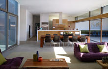Main living space looking towards kitchen and pantry - Photo Credit: John Linden