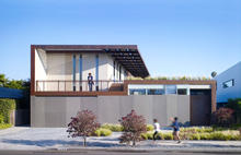 Street view showing green roofs and 12-kW solar system - Photo Credit: John Linden