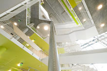 View upwards through atrium showcasing the multi-functional concrete slab. - Photo Credit: David Matthiesen