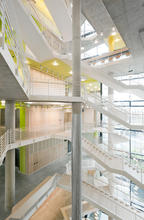 The atrium winds up the building connecting the various levels and program areas with stairs and ramps that bridge the void. - Photo Credit: David Matthiesen