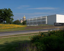 The building's south facing roof and natural ventilation stacks organize the building circulation. - Photo Credit: Stephen Miller