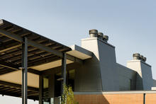 Ventilation stacks with wind-driven ventilation turbines. - Photo Credit: Stephen Miller